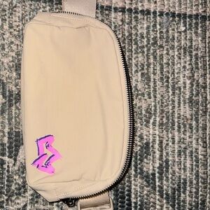 Beige Belt Bag with Pink Logo